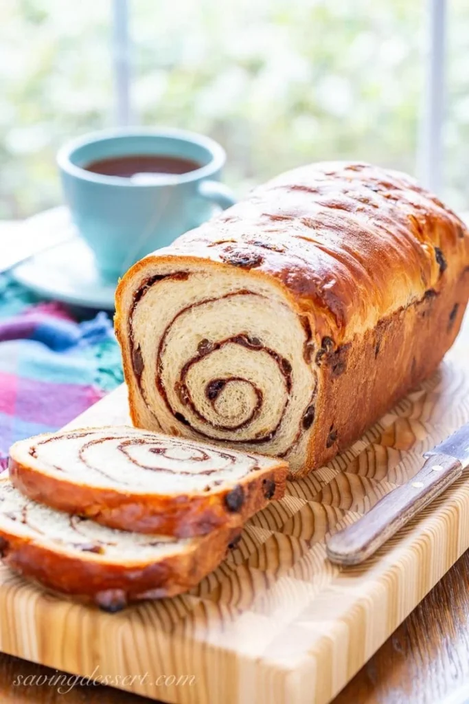 Raisin Bread with a teacup in the background. 